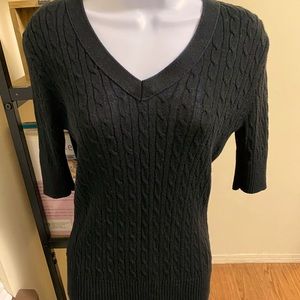 Half sleeve cable knit sweater that’s a staple with any good work outfit.